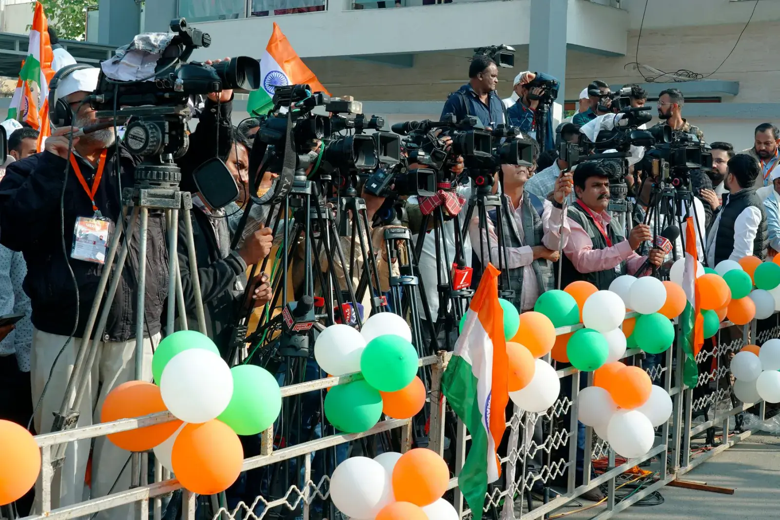 Row of television cameras lined up at a press event